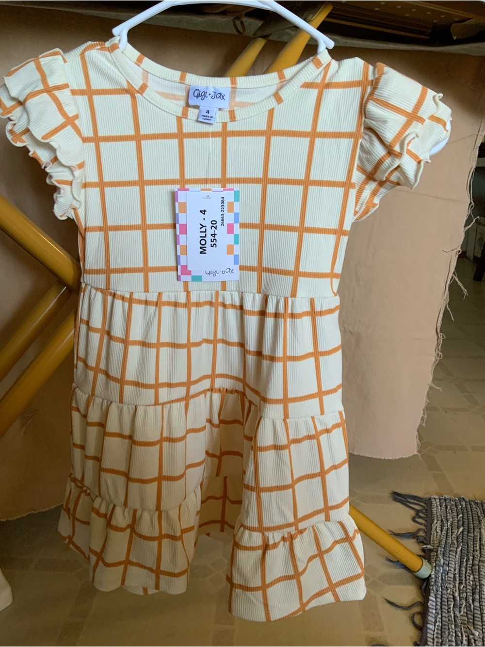 LuLaRoe Cream Dress with Orange Windowpane Grid and Ruffles